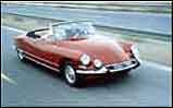 Citroen DS-21 cruising the highway with top down